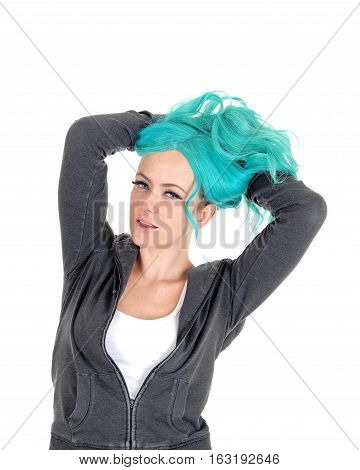 A pretty woman standing isolated for white background with long blue hair and messing it up.