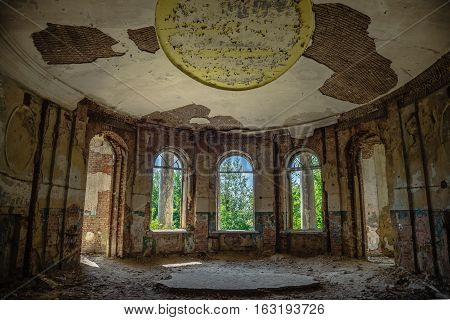 Interior of ruined round hall of an abandoned mansion Earl Voeikov