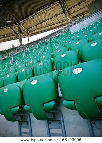 Multiple lines of green stadium plastic seats