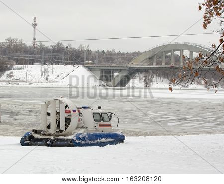 Amphibian rescue boat on the shore of a frozen channel, the Russian rescue boat.Hovercraft.