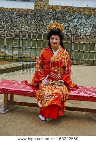HIMEJI, JAPAN - NOVEMBER 23: Japanese lady wearing traditional kimono in a Himeji castle, November 23, 2016 in Himeji, Japan.