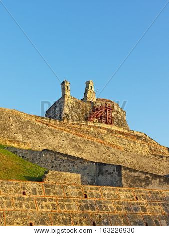 Bell and observation towers on top of San Felipe de Barajas fortress in Cartagena Colombia. The bastion known for its extensive maze of underground tunnels played significant role in the region colonial past.