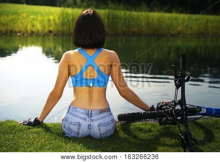 a woman stands on the road in the Park before the morning jog