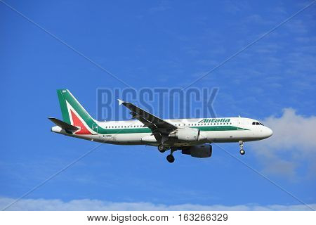 Amsterdam the Netherlands - July 15th 2016:EI-DSB Alitalia Airbus A320 approaching Polderbaan runway at Schiphol Amsterdam Airport arriving from Rome Italy