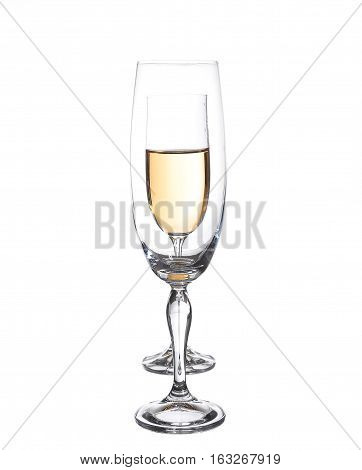 Full and empty champagne glasses with white wine