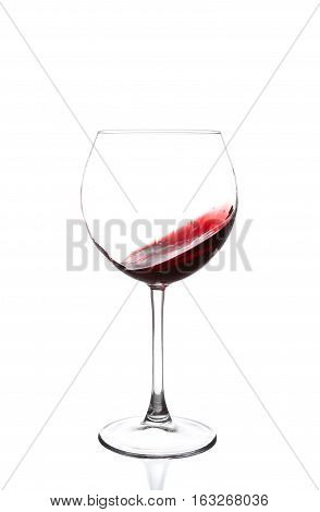 Red Wine Swirling In A Goblet Wine Glass, Isolated On A White Background