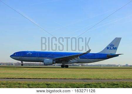 Amsterdam the Netherlands - November 25th 2016: PH-AOM KLM Royal Dutch Airlines Airbus A330 taking off from Polderbaan Runway at Amsterdam Airport Schiphol