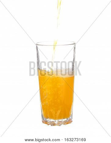 Pouring Orange Juice Into The Glass Isolated On White