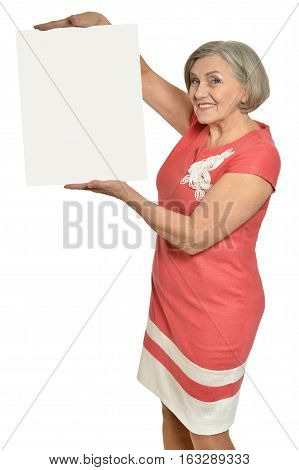 mature woman holding empty placard, against white background