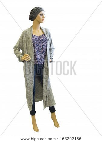 Full-length female mannequin wearing long cardigan top and blue jeans. Isolated on white background. No brand names or copyright objects.