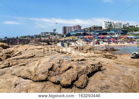 People And Colorful Umbrellas On Early Morning  Beach