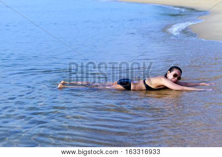 Lady enjoy relax swimsuit in Ban Krut Beach at Prachuap Khirikhun Province Thailand