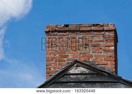 Chimney in Need of Repair on Roof Housetop