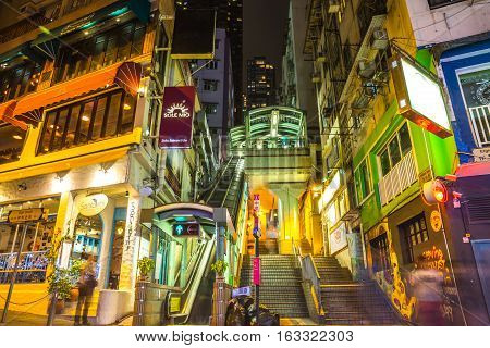 Hong Kong, China - December 10, 2016: entrance of Central-Mid-Levels escalator and Santorini Greek Restaurant in Elgin and Shelley St, Soho district, popular for bars, restaurants and nightlife.