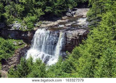 BLACKWATER FALLS STATE PARK, WV/USA - JUNE 30, 2016: A view of Blackwater Falls as seen through the trees on June 30 in Blackwater Falls State Park.