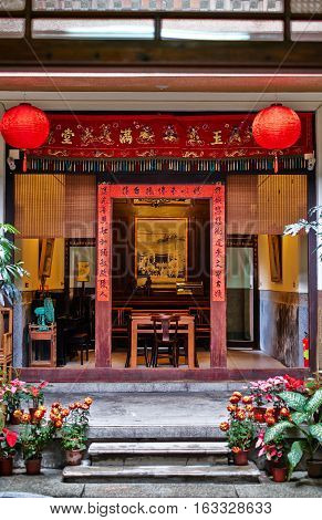 Xiluo, Taiwan - Mar. 12 : Traditional oriental chinese heritage building with spring couplets&red lantern in Taiwan (Chinese Translation on board : home full of wealth and blessing) at Mar. 12, 2016