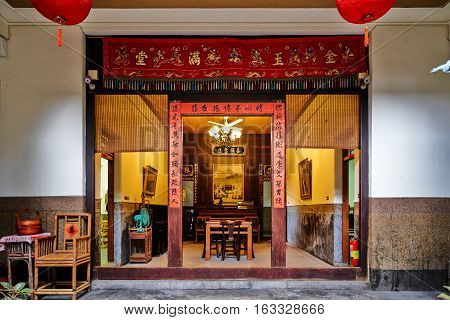 Xiluo, Taiwan - Mar. 12 : Traditional oriental chinese heritage building with spring couplets&red lantern in Taiwan (Chinese Translation on board : home full of wealth and blessing) at Mar. 12, 2016