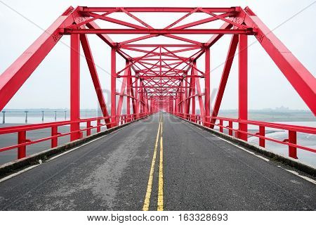 Symmetrical red steel structure construction of bridge and road in Xiluo Taiwan