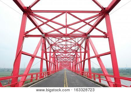 Symmetrical red steel structure construction of bridge and road in Xiluo Taiwan
