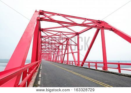 Symmetrical red steel structure construction of bridge and road in Xiluo Taiwan