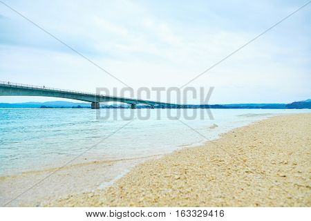 Kouri island bridge with beautiful sea level with blue sky in Okinawa Japan