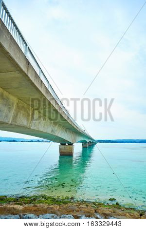 Kouri island bridge with beautiful sea level with blue sky in Okinawa Japan