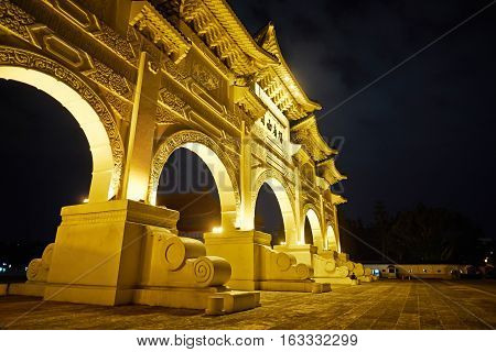 Asia culture - night view of Liberty Square (Archway of Chiang Kai Shek Memorial Hall) in Taipei Taiwan. the Chinese text on the archway : Liberty Square
