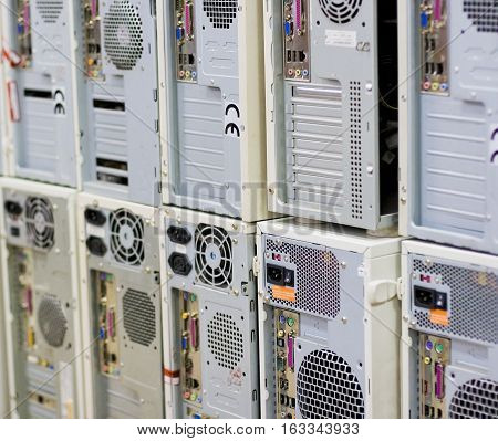 Rows of back lanes of standard desktop computers with various connectors
