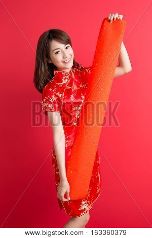 beauty woman wear cheongsam and show couplets with chinese new year