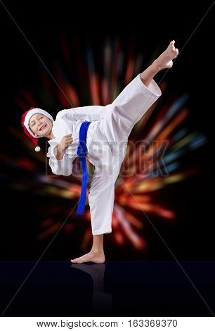 Against the background of bright rays sportsman is beating kick leg