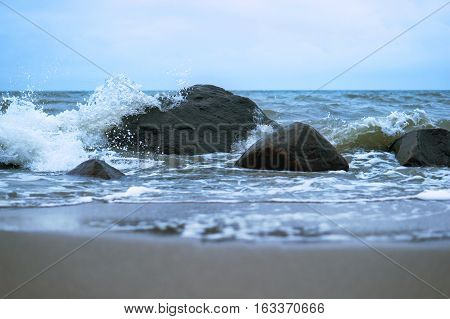 sea wave coast of the Baltic sea blue sea waves beat on the rocks sea stones