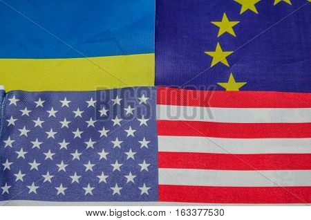 many flags - of America of Europe and Ukraine