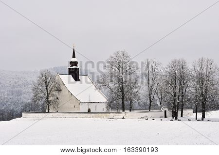 Winter landscape with a beautiful chapel near castle Veveri. Czech Republic city of Brno. The Chapel of the Mother of God.