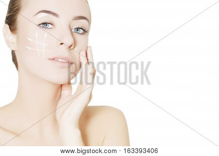 beautiful woman face with surgery marks isolated