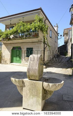 Fountain in square in Combarro a village of the province of Pontevedra in the Galicia region of Spain.