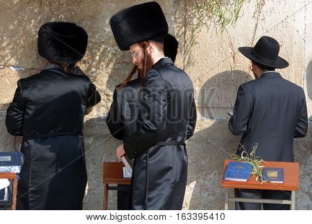 JERUSALEM ISRAEL 26 10 16: Jewish hasidic pray at the Western Wall, Wailing Wall the Place of Weeping is an ancient limestone wall in the Old City of Jerusalem. Second Jewish Temple by Herod the Great