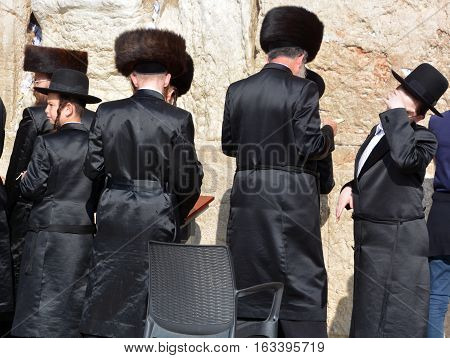 JERUSALEM ISRAEL 26 10 16: Jewish hasidic pray at the Western Wall, Wailing Wall the Place of Weeping is an ancient limestone wall in the Old City of Jerusalem. Second Jewish Temple by Herod the Great