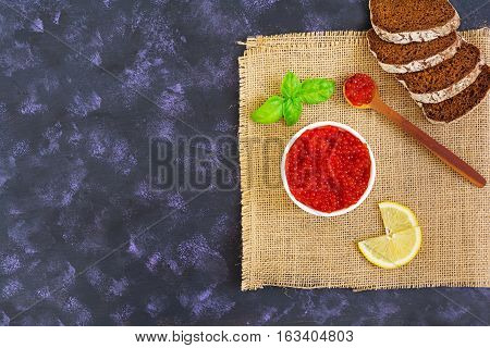 Red Caviar On Dark Background. Top View.