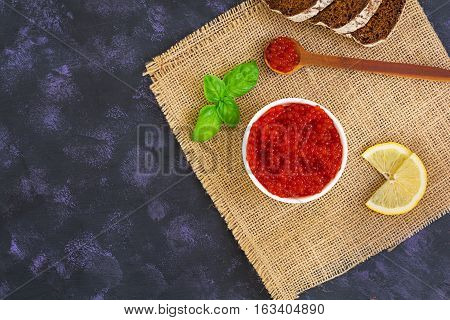Red Caviar On Dark Background. Top View.
