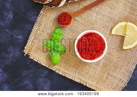 Red Caviar On Dark Background. Top View.