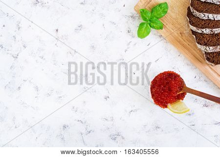 Red Caviar On White Background. Top View. Flat Lay