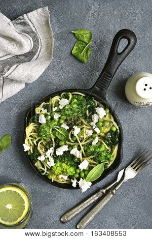 Spaghetti  Primavera With Green Spring Vegetables And Feta Cheese.top View.