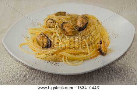 Pasta With Mussels And Herbs On The Plate