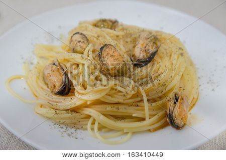 Pasta With Mussels And Herbs On The Plate