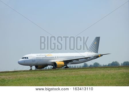 Amsterdam The Netherlands - June 12 2015: EC-MAX Vueling Airbus A320-200 takes of from Amsterdam Airport Polderbaan runway.