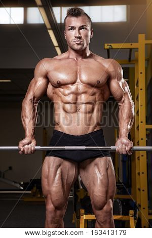 Muscular Bodybuilder Guy Doing Exercises With Dumbbell