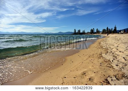 Sand Harbor beach untouched unique nature with emerald breaking waves