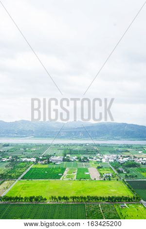 Panoramic bird eye aerial view of beautiful field and mountain under fantasy cloudy sky in Luyeh Hill Taitung the famous attractions in Taiwan