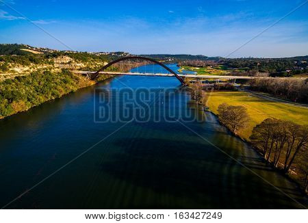 Aerial View Over Colorado River Looking At The Pennybacker Bridge In Austin , Texas Also Called The 