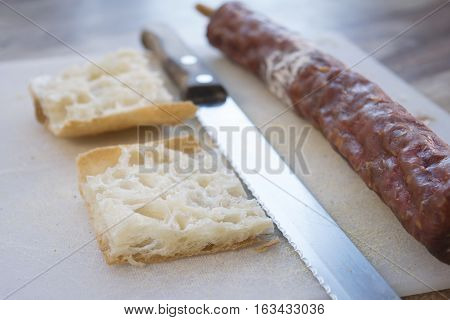 white flat bread filling with hot salami